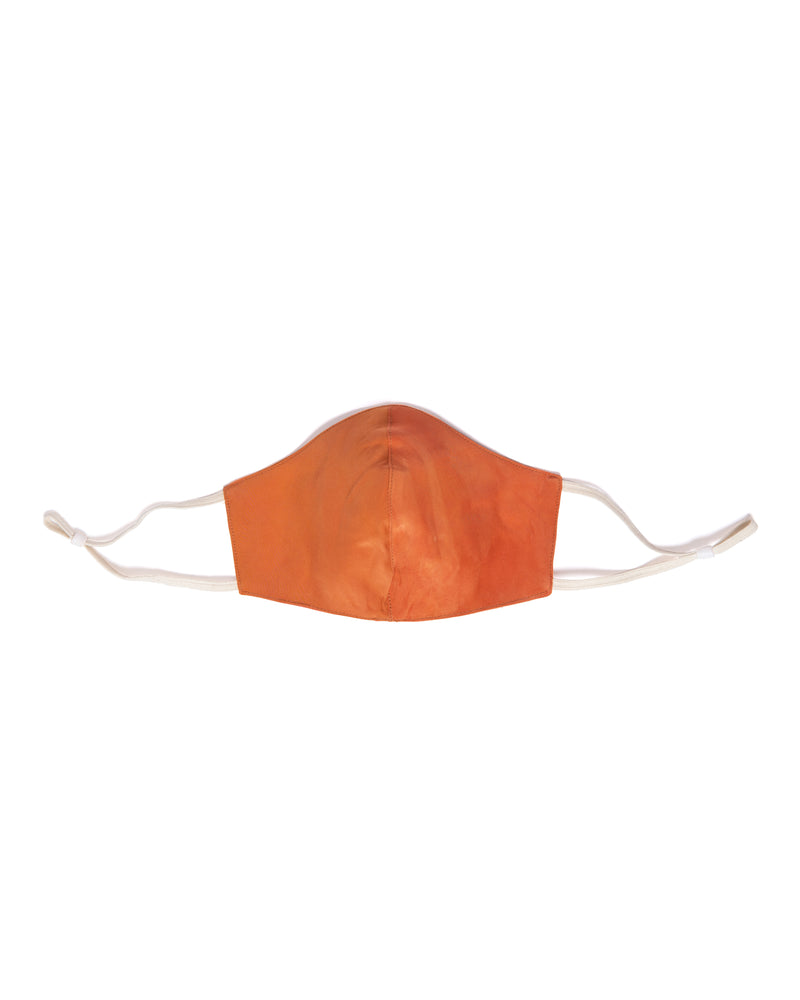 reversible silk face mask in orange color with cream elastic bands