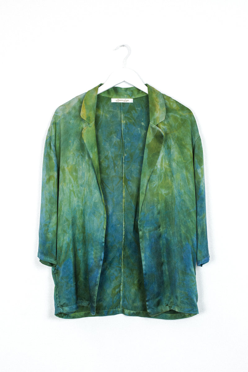 front of silk blazer in hummingbird green blue color with unique markings