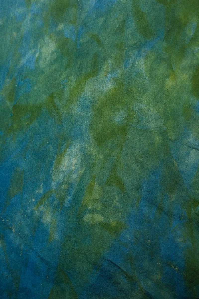 color swatch of silk blazer in hummingbird green blue color with unique markings