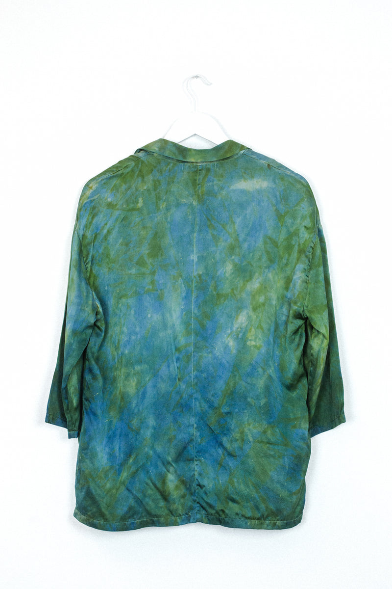 back of silk blazer in hummingbird green blue color with unique markings