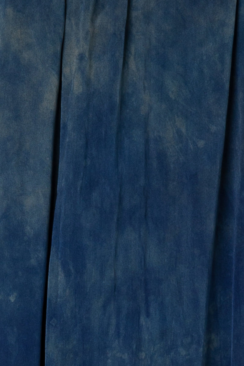draped fabric color swatch of wide leg silk pants in sapphire blue color with unique markings