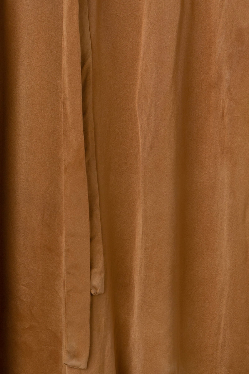 draped fabric color swatch of silk wide leg pants in muted copper color