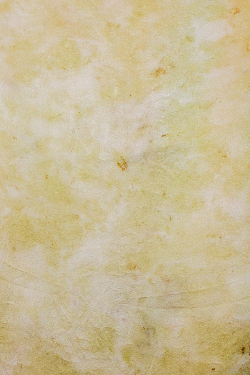 color swatch of medium silk scarf in light yellow with tan brown small markings