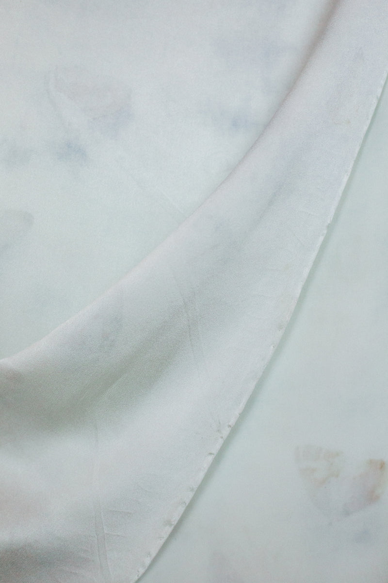 draped medium silk scarf in light ice blue with darker blue grey markings